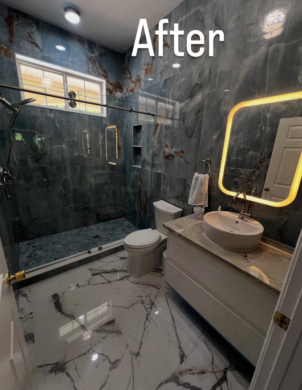 Blue-tile bathroom with glass shower — Completed